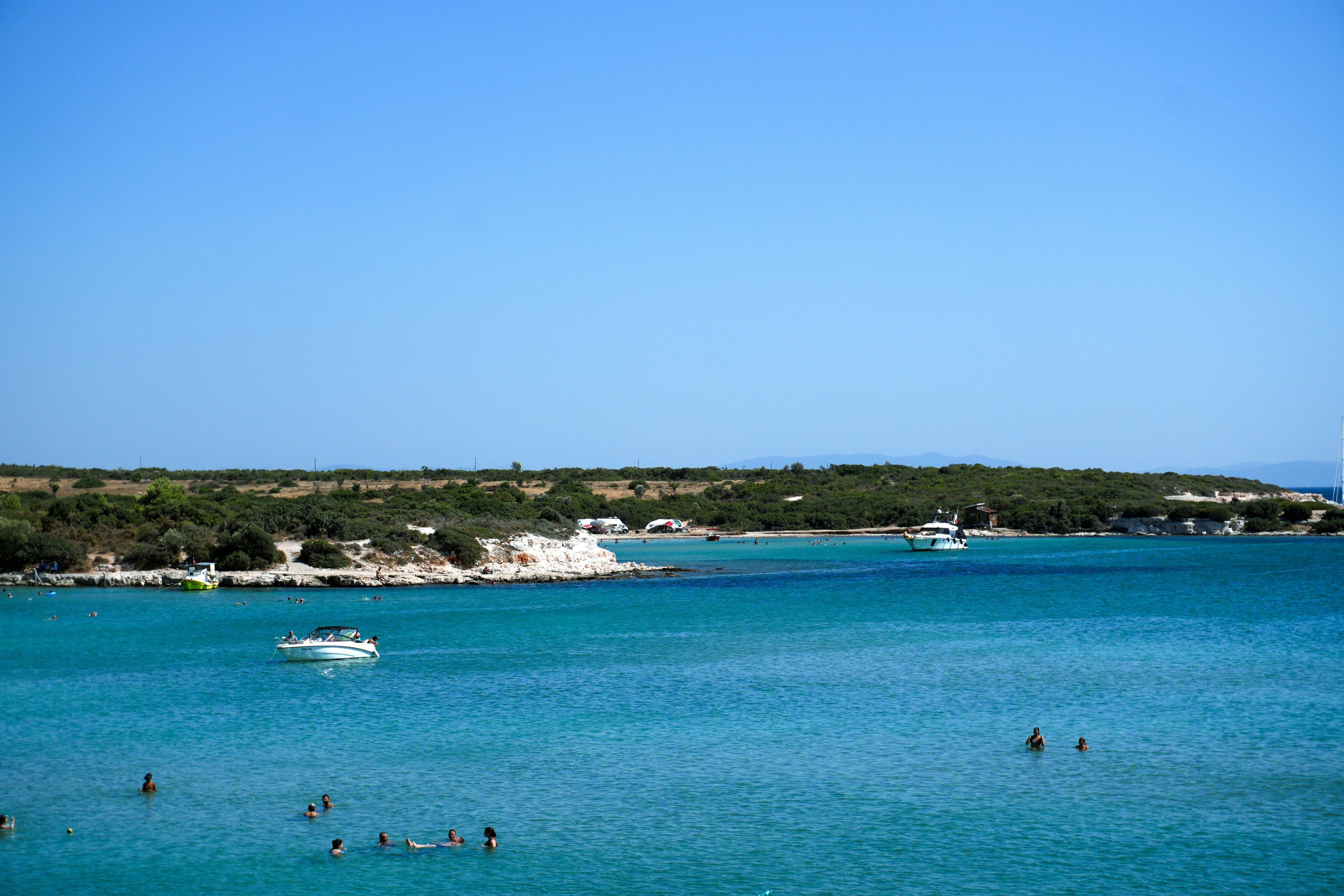 A body of water with boats floating in it