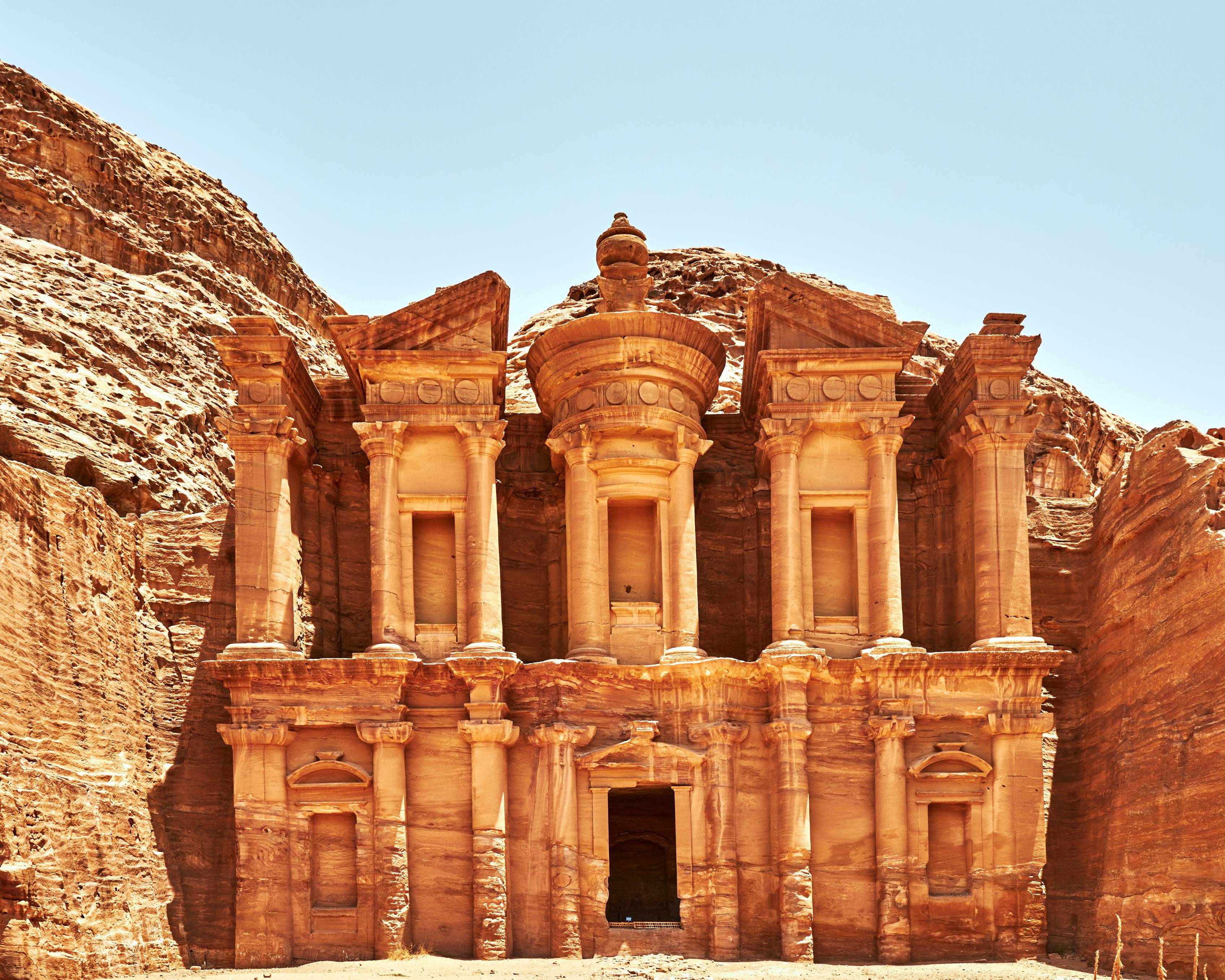 a large building in the middle of a desert