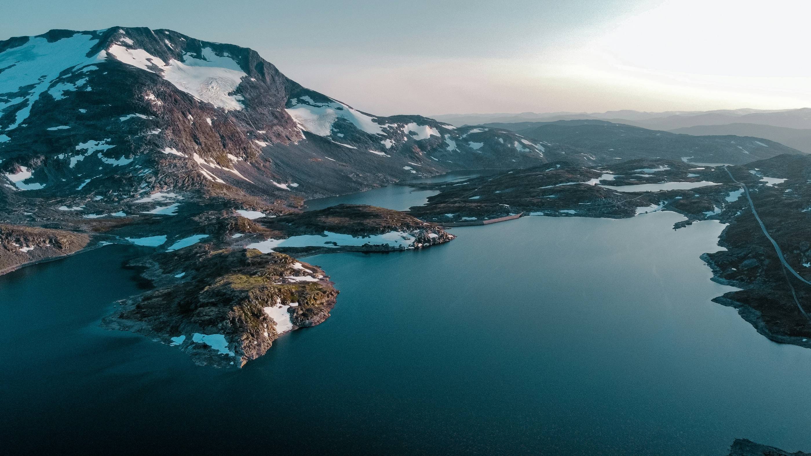 a body of water with land in the back