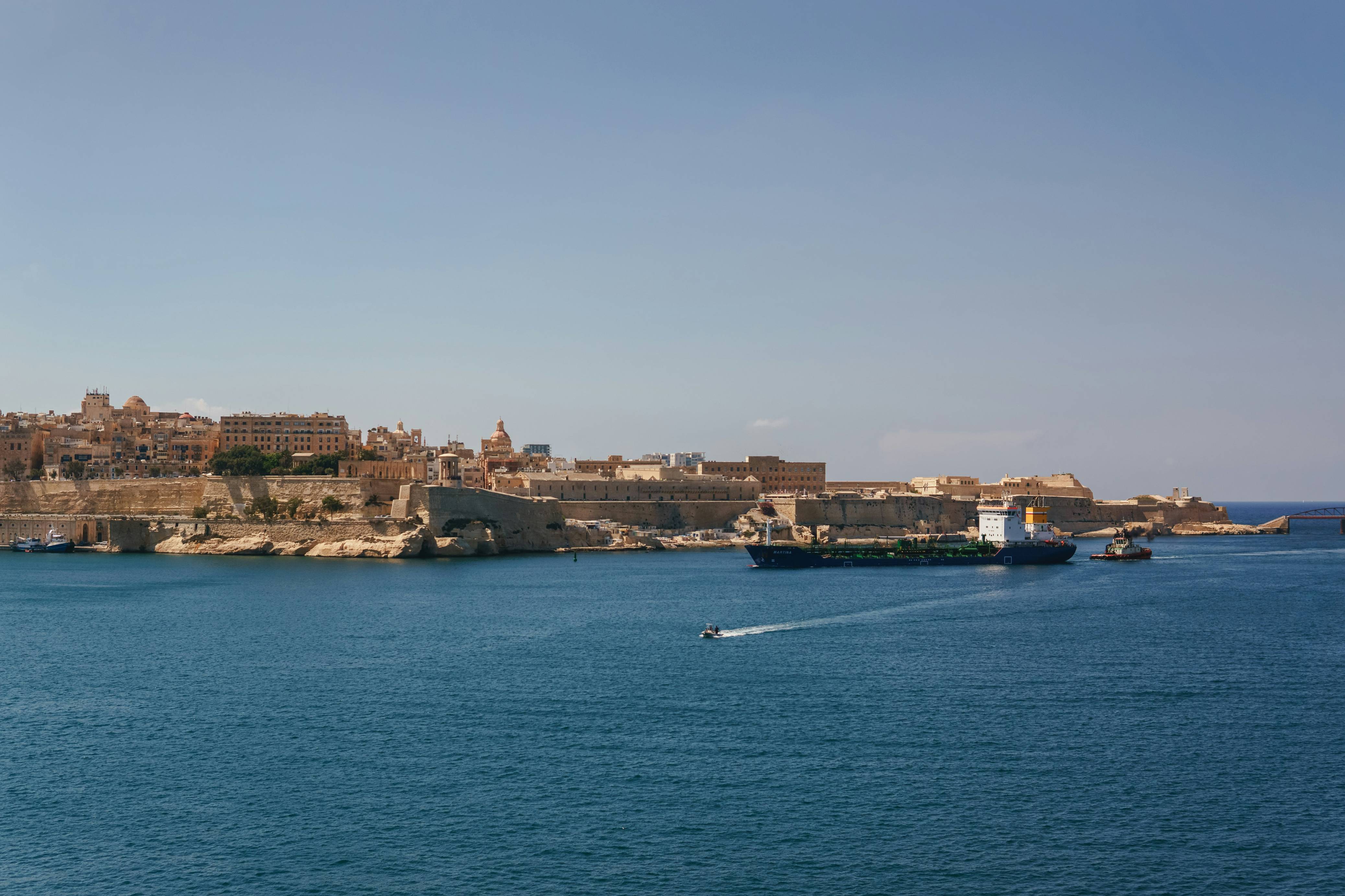 A large body of water with a city in the background